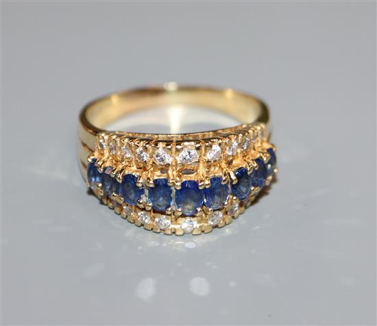An 18ct gold sapphire and diamond triple row ring, size T